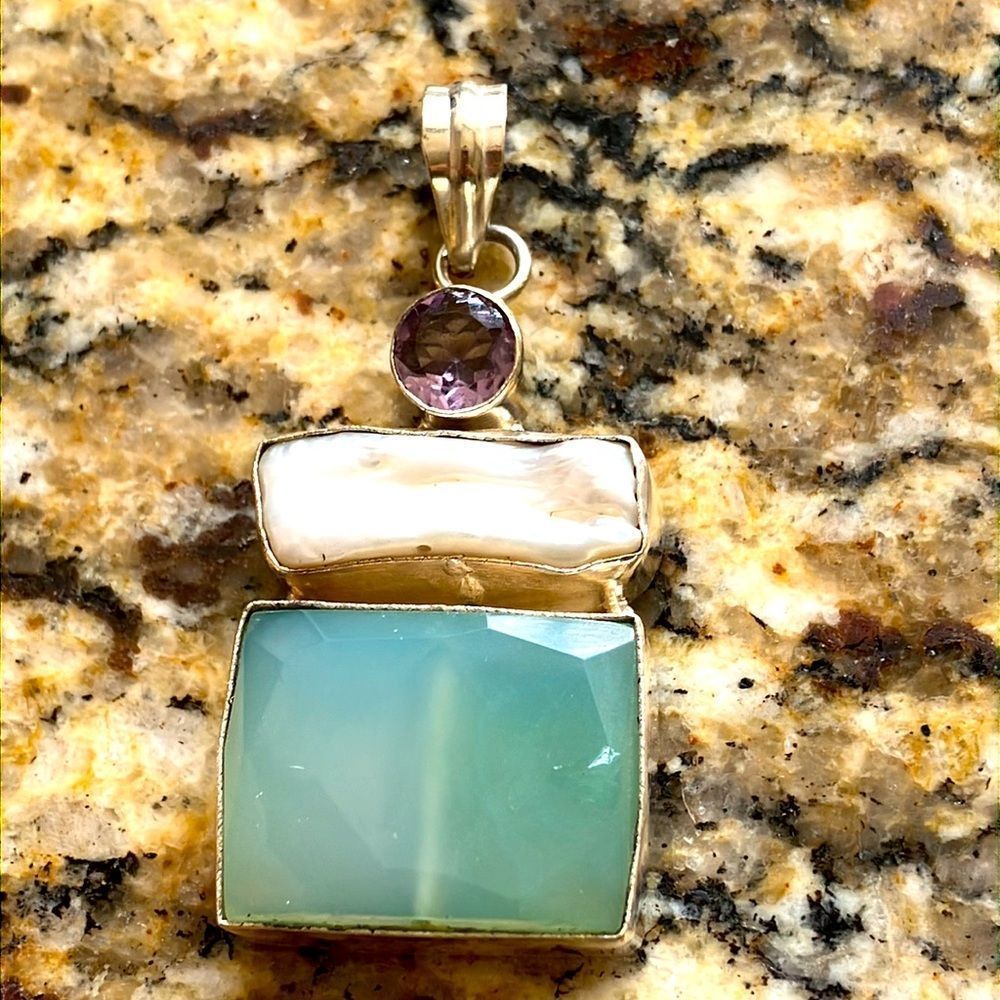 5/$25 Necklace Pendant with stones, not authentic.